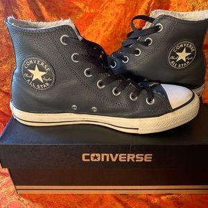 Pair of unisex converse high top leather shoes